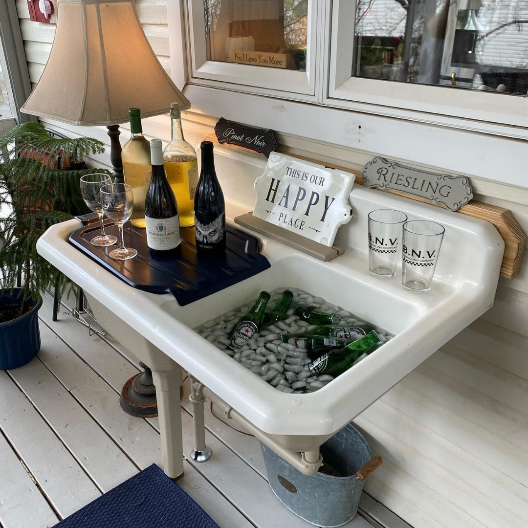 Upcycled into a porch wet bar. Drains out below deck